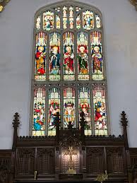 The stained glass window above the altar in the small chapel of my church. 💙