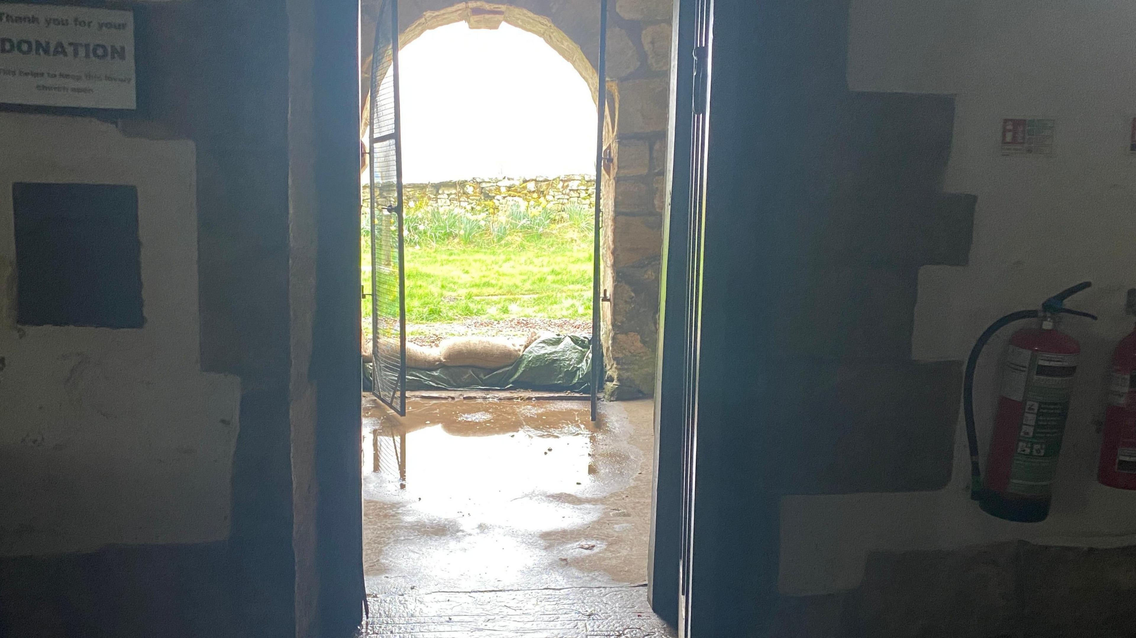 Heavy rain floods Grade I listed Northumberland church - BBC News